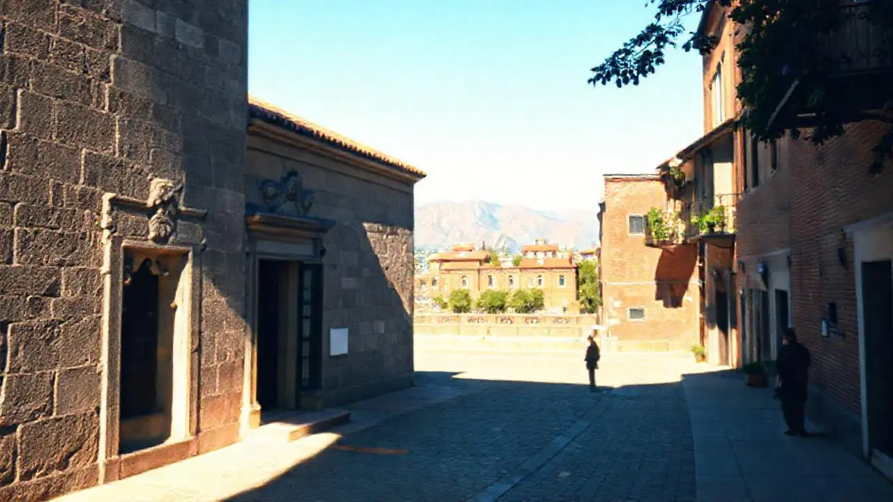 Vieja plaza con arquitectura y montañas lejanas